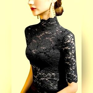 Black lace mock neck top with scallop sleeve detail. #acetop